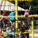 Kids climbing web at Elm Creek Play Area