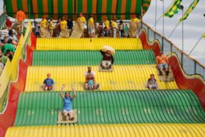 People sliding down the giant slide at the Minnesota State Fair