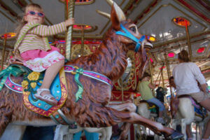 Girl riding carousel at the Minnesota State Fair