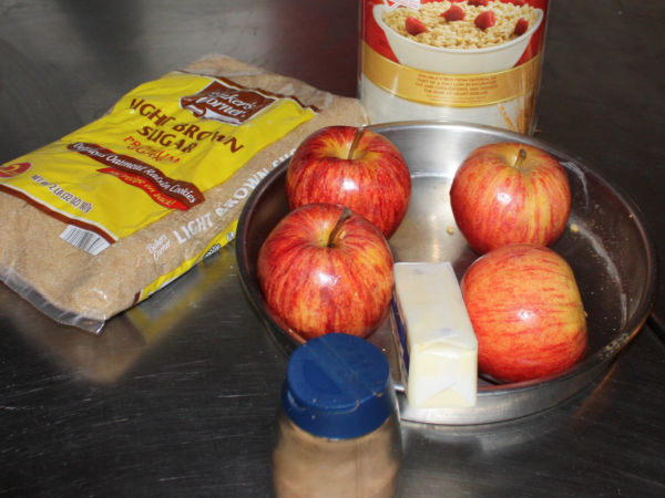 Ingredients for Apple Crisp - Oatmeal, apples, brown sugar, butter and cinnamon - in a pie pan