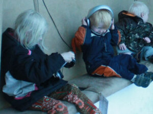 Three children at a listening station at the Walker Art Center in Minneapolis, Minnesota