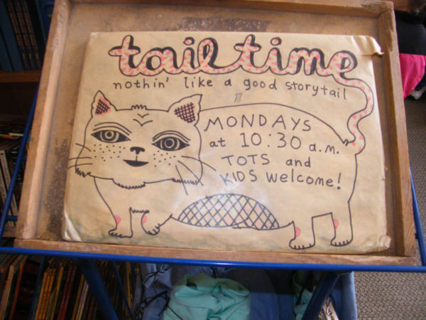 Tailtime sign at Wild Rumpus in Minneapolis Minnesota. Sign says: "tailtime. nothin' like a good storytail. Mondays at 10:30a.m. Tots and Kids Welcome.