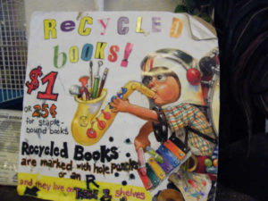 Sign at Wild Rumpus Bookshop in Minneapolis, MN: Recycled Books $1 or 25 cents for staple-bound books.