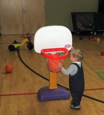 Saint Paul Toddler Activities - Toddler playing basketball at North Dale Recreation Center tot time