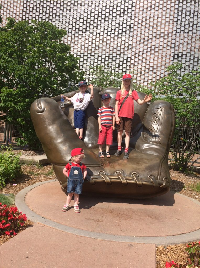 Four Kids Standing in the Target Field Giant Glove before a Twins Baseball Game in Minneapolis Minnesota