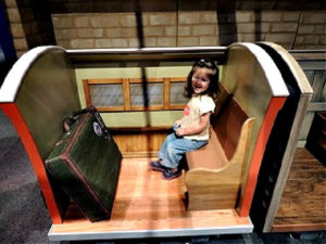 Girl riding Thomas Train during national train day evebt
