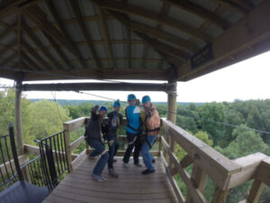 Two couples celebrating after finishing the Kerfoot Canopy Zipline tour