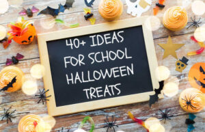 Chalkboard surrounded by Halloween decor says "40+ Ideas for School Halloween Treats"