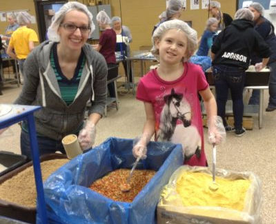 volunteering with kids at Feed My Starving Children