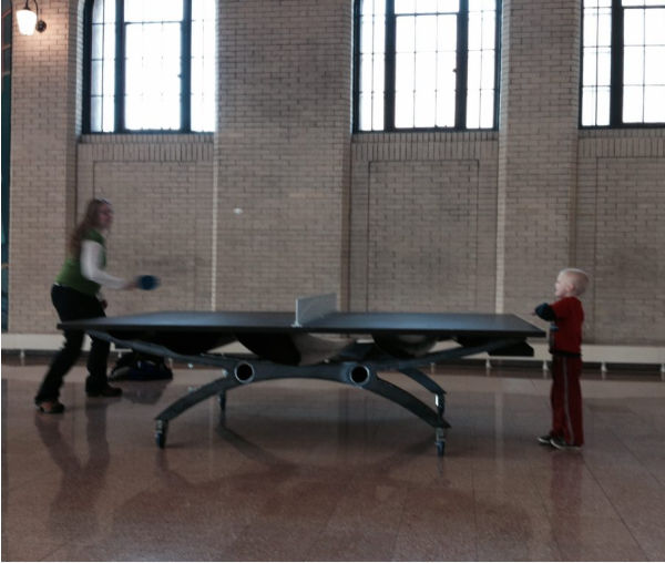 Mother and son playing ping pong at the Union Depot Train Station in Saint Paul, Minnesota