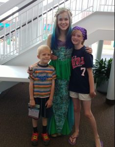Children posing with the actress playing Ariel in the 2015 production of The Little Mermaid Jr. at Stages Theatre Company in Hopkins, Minnesota