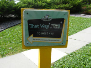 Sign pointing the way to Hole #15 of the mini golf course in Veterans Park, Richfield, Minnesota