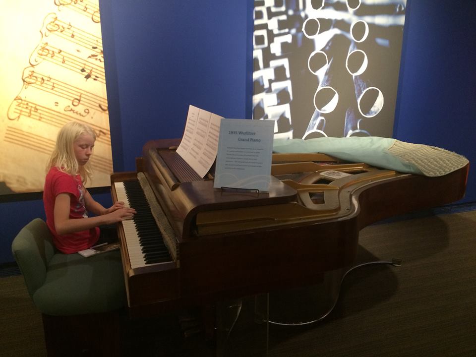 Girl playing piano at the Schubert Club Museum in Saint Paul Minnesota