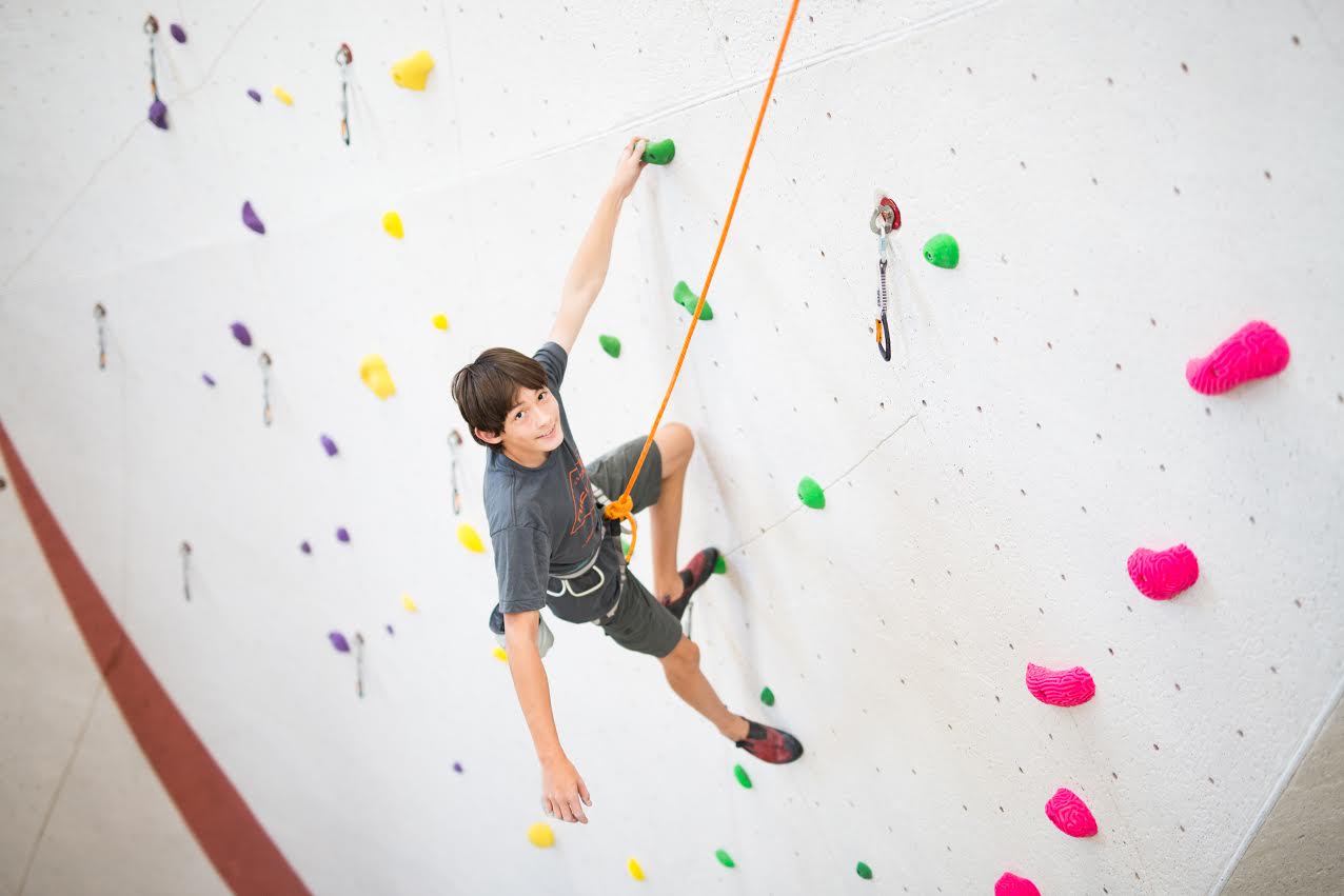 Boy climbing wall at Vertical Endeavors in Bloomington Minnesota