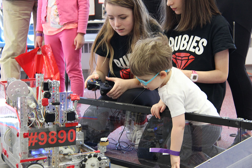 Kids playing with a robot during Robot Day at The Works Museum in Bloomington Minnesota