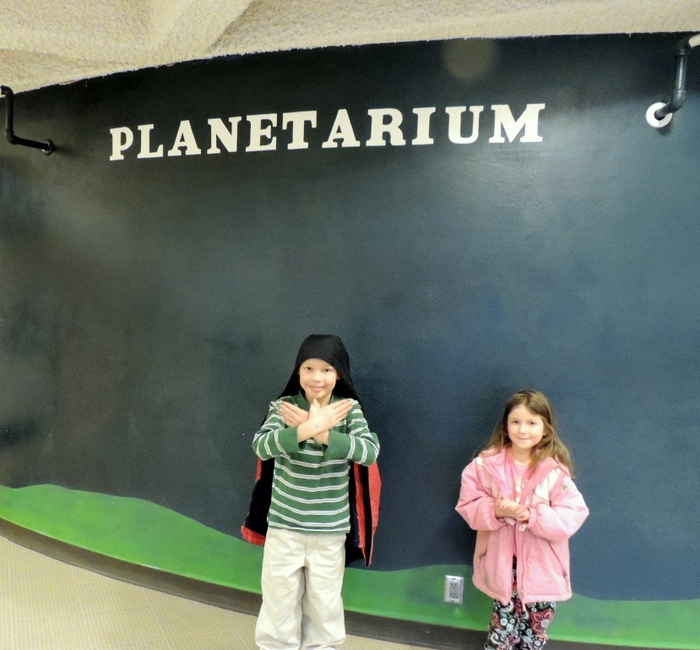 Two children visiting the Como Planetarium in St. Paul Minnesota for Minnesota Night Sky Viewing