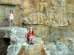 Girls exploring rocks in Teddy Bear Park in Stillwater Minnesota