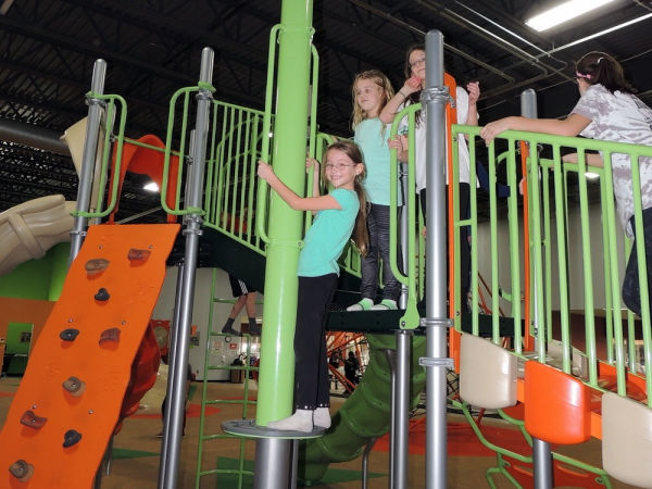 Kids climbing on indoor playground at Good Times Park in Minnesota
