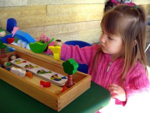 Young girl plays with Toys at a Lil' Explorer Thursday at Como Zoo in Saint Paul, Minnesota