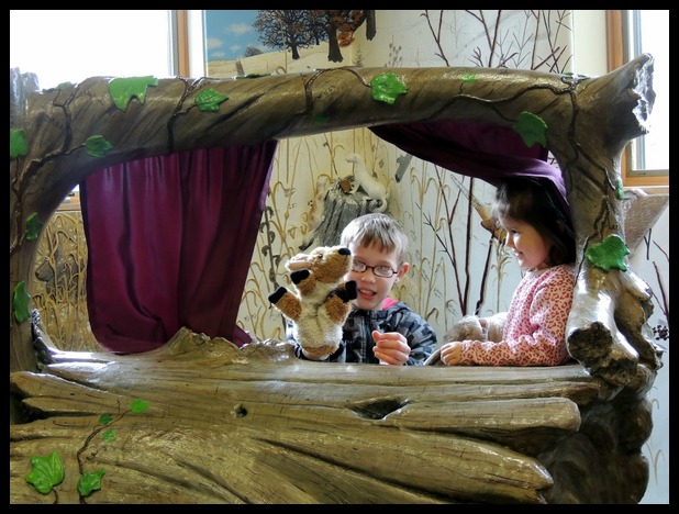 Children playing with puppets at Richardson Nature Center in Bloomington, Minnesota