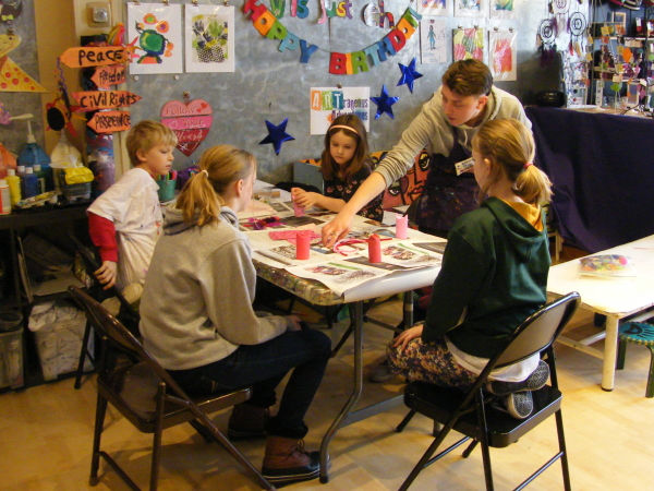 Family preparing for Valentine's Day with arts and crafts at ARTrageous Adventures in Minneapolis, Minnesota
