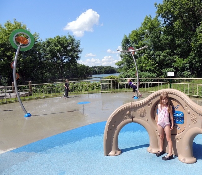 Girl playing in splash pad at Miller Park in Eden Prairie