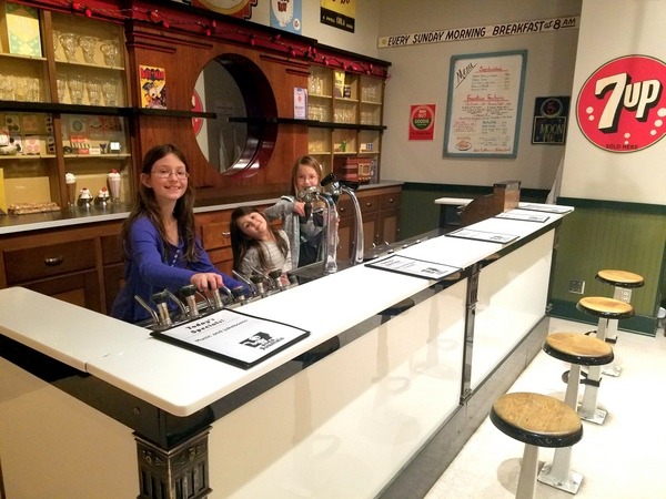 Girls playing in diner exhibit at the Minnesota History Center in Saint Paul.