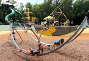 Kids playing on Elm Creek Play Area Playground in Maple Grove Minnesota