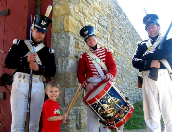 Boy and costumed soldier characters at Fort Snelling Historic Site in St. Paul, MN