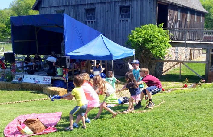 Kids playing tug-of-war at Rock the Barn at Dodge Nature Center in South St. Paul, Minnesota