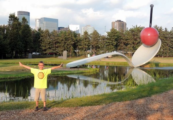 Boy in front of the iconic Cherry & Spoon at the Walker Art Center Sculpture Garden in Minneapolis, MN