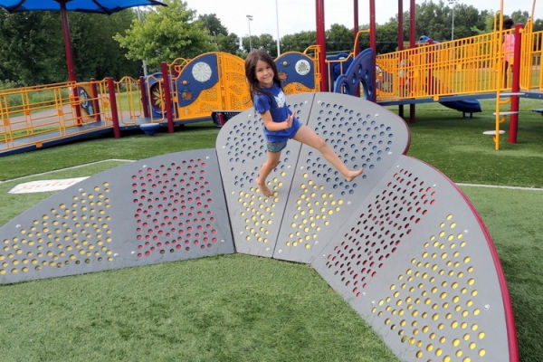 Young Girl running the Schaper Park Obstacle Course in Golden Valley, Minnesota