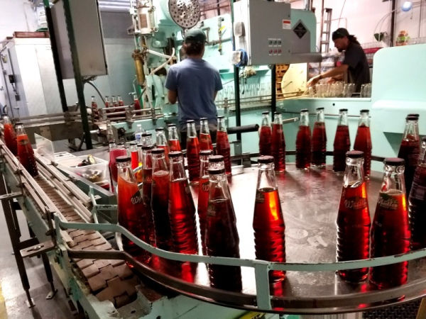A soda packing assembly line at Blue Sun Soda Shop in Minnesota