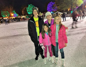 Four children posing together at the Loring Park Winterskate in Minneapolis Minnesota