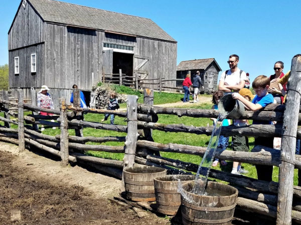 Visitors exploring Oliver Kelley Farm in Elk River, Minnesota