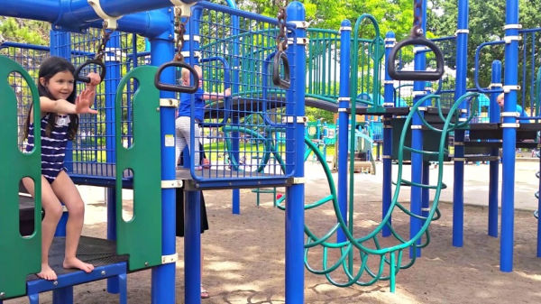 Children playing on playground at Audubon Park in Minneapolis, Minnesota