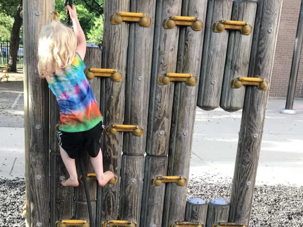 Girl climbing on playground at Kenwood Elementary School