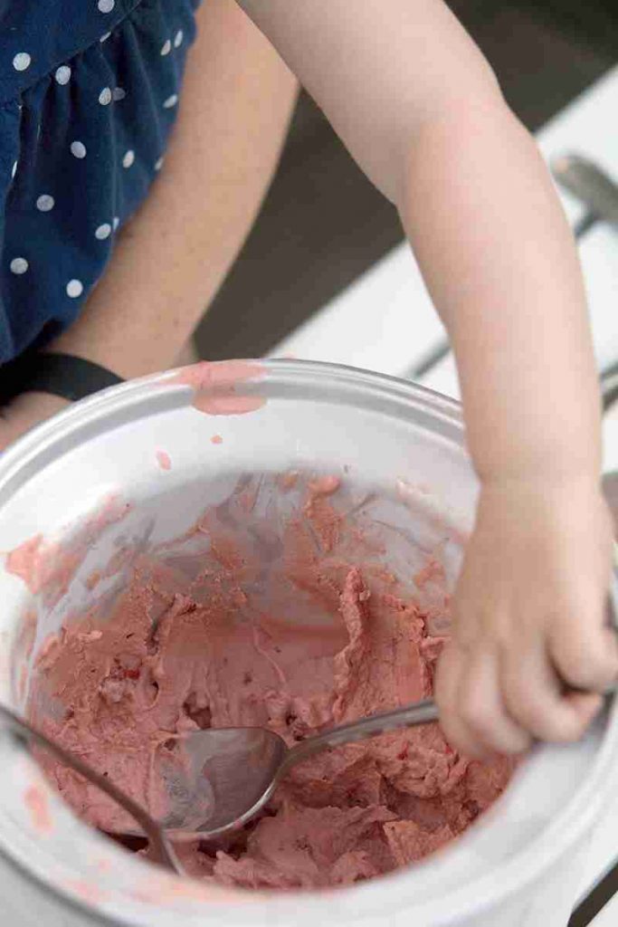 little fingers scooping up fresh ice cream