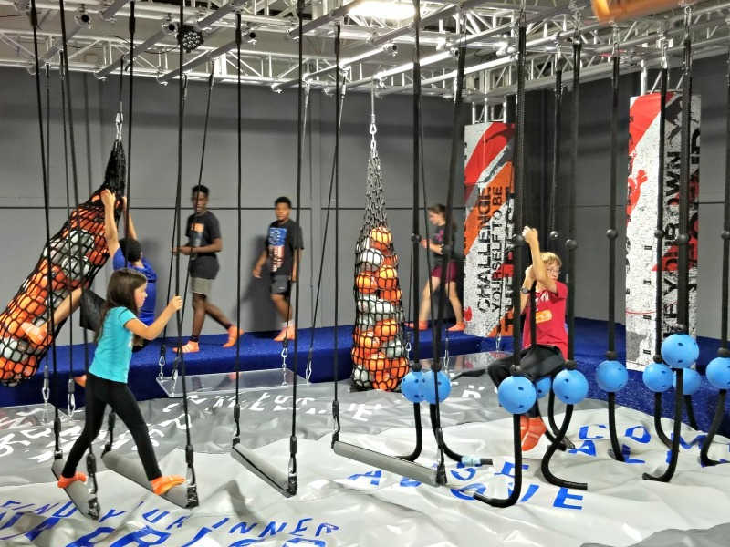 Boy and Girl navigating the Sky Zone Obstacle Course