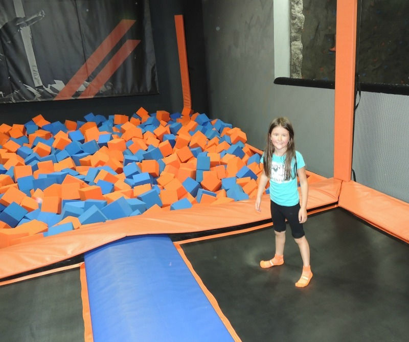 Girl playing by the FoamZone at Sky Zone Trampoline Park