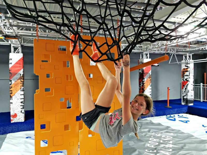 Girl climbing nets at Skyzone in Maple Grove, Minnesota