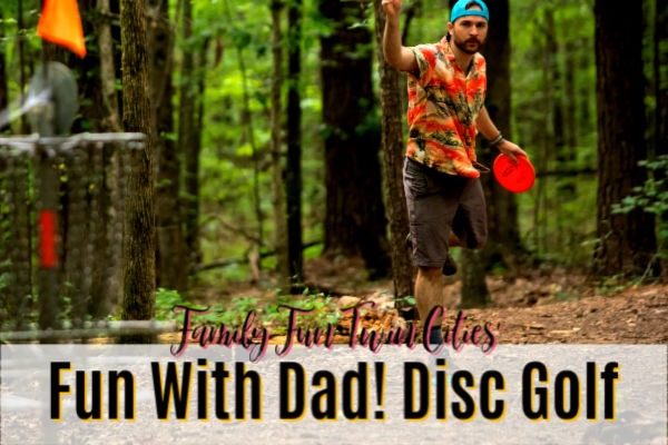 Fun With Dad! Disc Golf - Man throwing discs toward a disc golf basket