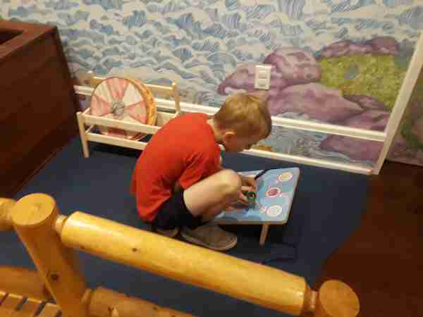 boy playing with a puzzle at the American Swedish Institute in Minneapolis MN