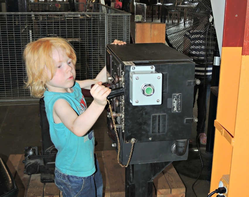 Boy learning about trains in interactive exhibit at the Minnesota Transportation Museum