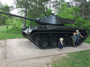 Kids looking at tank in Bunker Hills Park in Andover, Minnesota