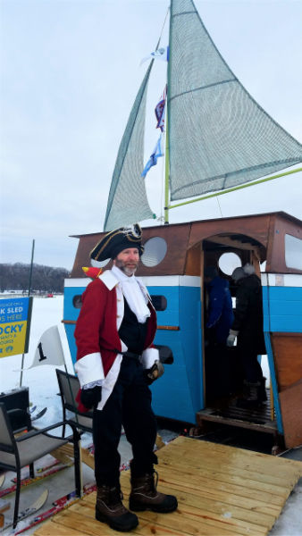 Man dressed as pirate in front of his Art Shanty, Lake Harriet, Minneapolis Minnesota