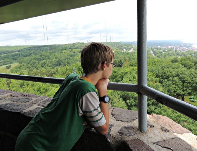 Boy taking in the view of Duluth from Enger Park Tower
