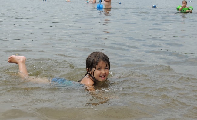 Girl swimming in Lake Josephine, Ramsey County, Minnesota