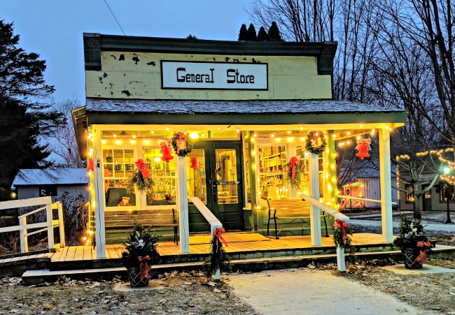 Dakota City General Store decorated for Christmas with wreaths and lights.