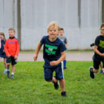 Kids running at an AKAsport Camp
